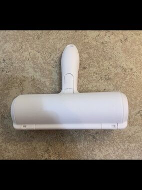 Reusable pet hair remover roller. Works by using a specialized brush to trap fur
